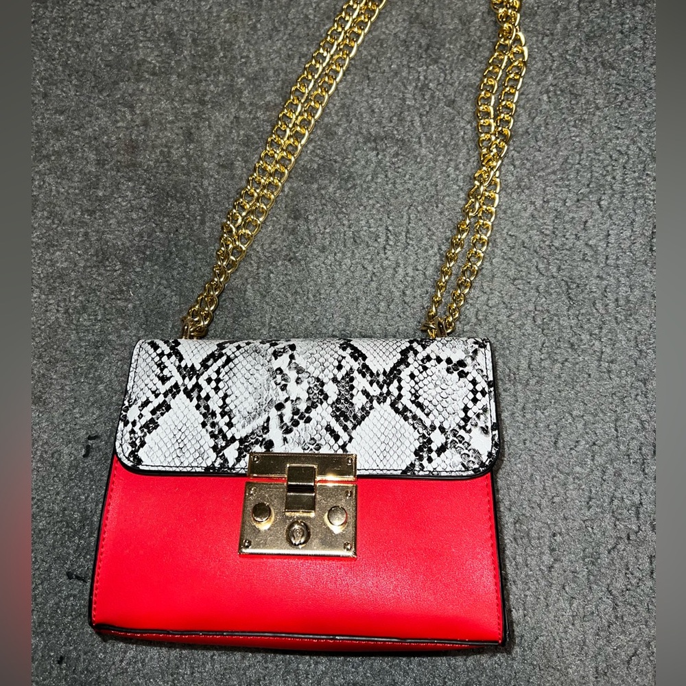 Red and snake print purse